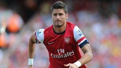 Wenger hopes new signings Podolski, left, and Giroud will supply the goals, while Cazorla will provide the ammunition. Olly Greenwood / AFP; Stuart MacFarlane / Getty Images; Jon Super / AP Photo