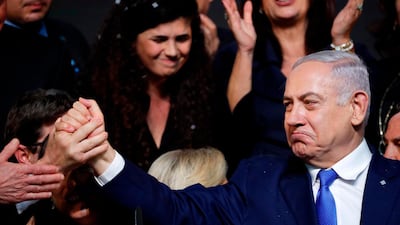 Israeli Prime Minister Benjamin Netanyahu with supporters at his Likud Party headquarters. Thomas Coex / AFP