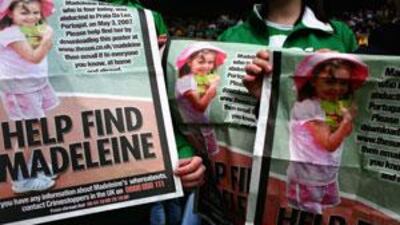 Celtic Football Club fans hold posters of Madeleine McCann inside Celtic Park in Glasgow, Scotland, eight days after her disappearance.