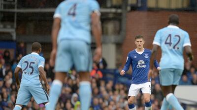 Everton's John Stones looks to play the ball against Manchester City on Sunday during their Premier League contest at Goodison Park. Oli Scarff / AFP