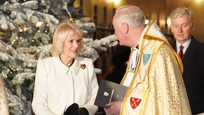 The Queen Consort leaves the service. PA