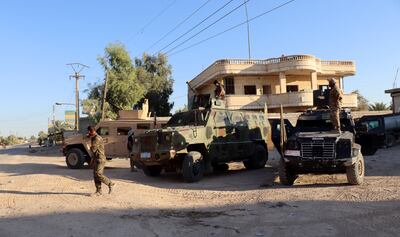 Members of the Kurdish-led, US-backed Syrian Democratic Forces take up positions at Dhiban in Deir Ezzor province, eastern Syria, having announced an end to military operations against Arab tribes. EPA