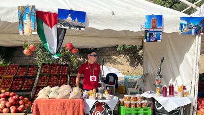 A stall owner waits for customers at the annual pomegranate festival in the Tunisian city of Testour. Ghaya Ben Mbarek / The National