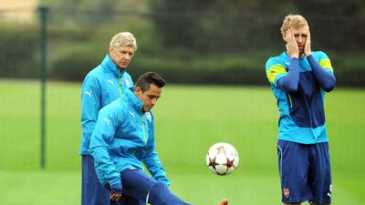 Arsenal manager Arsene Wenger, left, has relied heavily on Chilean striker Alexis Sanchez, centre, to get results this year as he will be needed again on Saturday when they meet Manchester United. Olly Greenwood / AFP