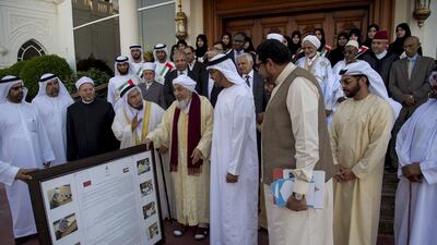 Sheikh Mohammed bin Zayed, Crown Prince of Abu Dhabi and Deputy Supreme Commander of the Armed Forces, Sheikh Tahnoon bin Mohammed, Ruler’s Representative of the Eastern Region of Abu Dhabi (front row 7th L) and Sheikh Hamdan bin Zayed, Ruler’s Representative in the Western Region of Abu Dhabi (front row 8th L), stand for a photograph with a delegation of participants of the Forum for Promoting Peace in Muslim Societies, during a Sea Palace barza. Seen with Dr Ali Rashid Al Nuaimi, Director General of Abu Dhabi Education Council and Abu Dhabi Executive Council Member (front row L), and Sheikh bin Bayyah (front row 5th L). Rashed Al Mansoori / Crown Prince Court — Abu Dhabi
