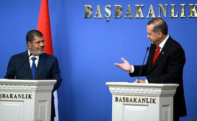 Egypt's former leader Mohammed Morsi, left, with Turkish President Recep Tayyip Erdogan in 2012. AFP