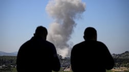 People watch as smoke rises following an Israeli strike in Nabatieh, Lebanon, May 7, 2026. REUTERS / Stringer