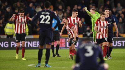Sheffield United players celebrate as VAR rules out a late West Ham equaliser. AFP