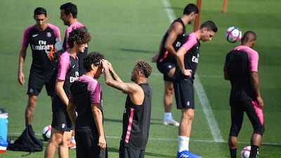 Neymar touches the head of Brazilian defender Marquinhos. AFP