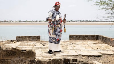 Thioro Faye, a high priestess known as saltigue among the Serer people, performs a Xooy divination ceremony in Fatick, Senegal. AFP