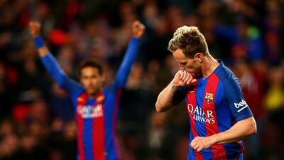 Barcelona’s Ivan Rakitic celebrates after scoring his team’s third goal. Dan Istitene / Getty Images