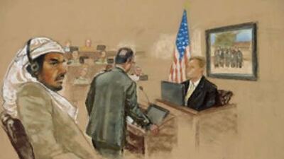 Salim Hamdan sits during his trial inside the war crimes courthouse at Camp Justice, the legal complex of the U.S. Military Commissions, at Guantanamo Bay, in this artist's impression.