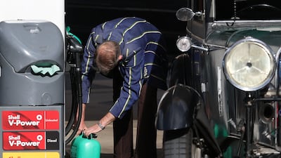 A driver at a petrol station in London. Inflation in the UK remains well above the Bank of England's threshold, underpinned by higher hydrocarbon costs. Reuters