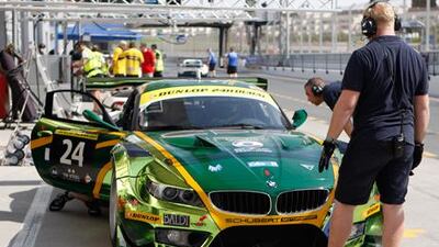 Pit crews prepare a car for the 24 Hours of Dubai endurance series at Dubai Autodrome.