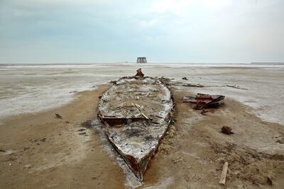The wreckage of a boat is seen stuck in solidified salts and sands at Lake Urmia, in a photo taken on February 16, 2014. AP