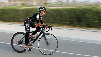 Emirati Masooma Ali cycles at the Al Khawaneej cycle track during the evening in Dubai. Pawan Singh / The National