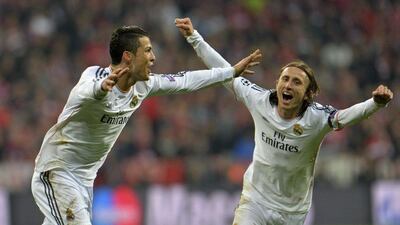 In this April 29, 2014 file photo, Real's Cristiano Ronaldo celebrates with teammate Luka Modric, right, after scoring during the Uefa Champions League semi-final against Bayern Munich. Real Madrid meet Juventus in the Champions League final in Cardiff on Saturday June 3, 2017. Kerstin Joensson / AP file