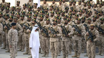 Sheikh Mohamed bin Rashid, Vice-President and Ruler of Dubai (2nd L), inspects military personnel during the reception at Zayed Military City. Abdullah Al Junaibi / Ministry of Presidential Affairs