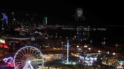 Drones fly in formation to create an image of Crown Prince Sheikh Meshal above Kuwait's Green Island
