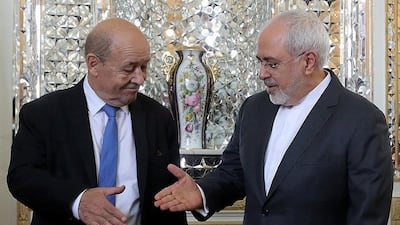 Iranian Foreign Minister Mohammad Javad Zarif greets his French counterpart Jean-Yves Le Drian in Tehran on March 5, 2018. Tasnim News Agency via Reuters