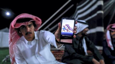 Abu Dhabi, United Arab Emirates, December 10, 2019. Men of the Dawasir tribe from Saudi Arabia relax after a victory at the Al Dhafra Festival in Abu Dhabi, UAE. Victor Besa / The National Section: NA Reporter: Anna Zacharias