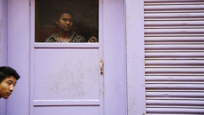 A man looks toward opposition supporters (not pictured) chanting slogans as they take part in a protest rally against the proposed constitution during a nationwide strike, called by the opposition parties in Kathmandu, Nepal. Nepal will adopt its first full democratic charter on Sunday, a historic step for a nation that has seen war, a palace massacre and devastating earthquakes since a campaign to create a modern state began more than 65 years ago. Navesh Chitrakar / Reuters