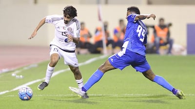 Al Jazira's Khalfan Mubarak tries to evade an Al Fateh defender during their Asian Champions League match in Al Hasa, Saudi Arabia on Tuesday, March 14, 2017. Courtesy Al Jazira FC
