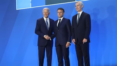 From left, Mr Biden, French President Emmanuel Macron and Nato Secretary General Jens Stoltenberg. Bloomberg
