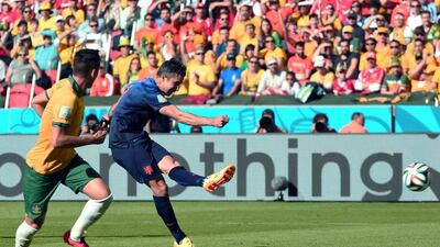 Robin van Persie shoots to score and equalise against Australia 2-2 for the Netherlands on Wednesday in 2014 World Cup Group B play. Damien Meyer / AFP