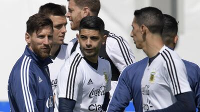 Argentina's forward Lionel Messi, left, has many fans all over the world - for good reason, too. Juan Mabromata / EPA