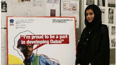 Emirati Hessa al Hasshimi, 21, a graduating graphic design student with one of her posters at Zayed University.