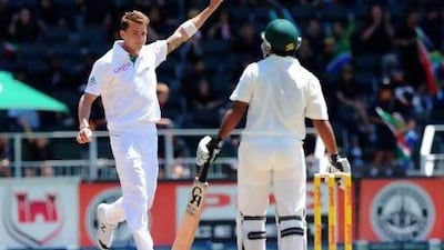 South African fast bowler Dale Steyn, left, celebrates the wicket of Shafiq Asad, right, on day four of the first test match between South Africa and Pakistan last week at Wanderers Stadium in Johannesburg. AFP Photo
