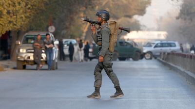 An Afghan policeman keeps watch near the site of a blast in Kabul's heavily fortified diplomatic quarter on October 31, 2017. Omar Sobhani / Reuters