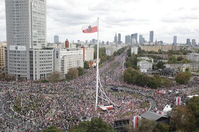 A giant Second World War Polish home army flag is raised above the "March of a Million Hearts" rally organised by opposition parties, in Warsaw on October 1. Reuters