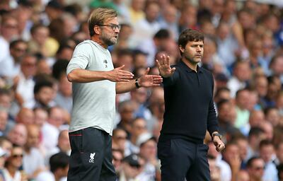 Liverpool manager Jurgen Klopp (left) and Tottenham manager Mauricio Pochettino on the touchline. PA Photo