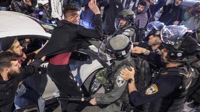 Border guards scuffle with Palestinians. AFP