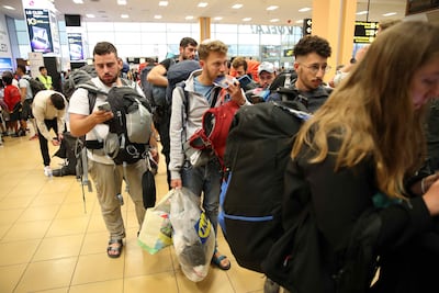Young Israelis queue to board a flight to Tel Aviv at the Jorge Chavez International Airport in Lima, Peru, on Tuesday. EPA