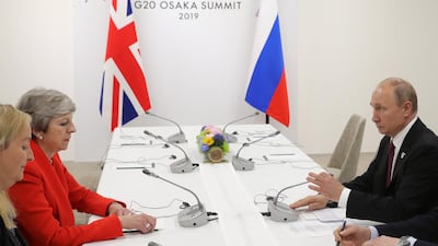 British Prime Minister Theresa May and Russian President Vladimir Putin meet on the sidelines of the G20 summit in Osaka, Japan. EPA