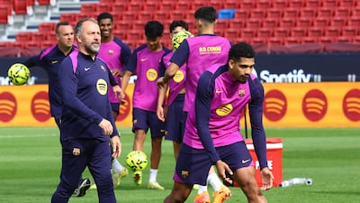 Barcelona coach Hansi Flick and Ronald Araujo during training at the redeveloped Camp Nou. Reuters