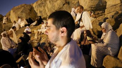 Pilgrims gather in prayer at Mountain of Mercy. Reuters