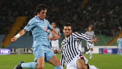 Spurs' Gareth Bale is challenged by Maurizio Domizzi of Udinese during the Uefa Cup match at the Stadio Friuli in October 2008. Getty