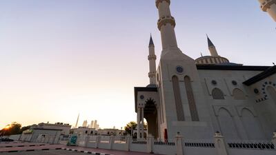 The sun rises over Al Farooq Omar Bin Al Khattab Mosque on the first morning of Ramadan. Mosques remain closed due to Covid-19, Dubai. Chris Whiteoak / The National