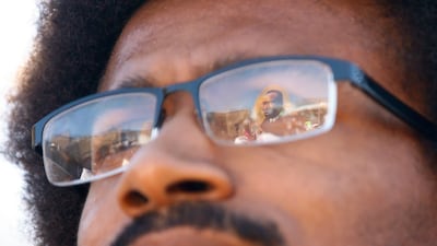 Martin Luther King is reflected in Justin Pearson's glasses on a march in Memphis, Tennessee. AP
