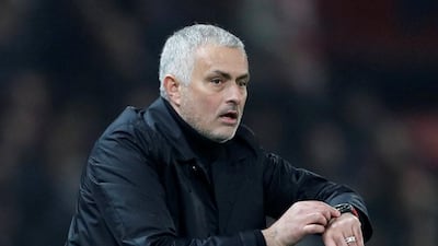 Manchester United manager Jose Mourinho checks his watch as the signal goes up for four minutes of added time. Reuters