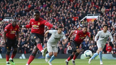 Paul Pogba converts his second penalty in a 2-1 win against West Ham at Old Trafford in 2019. EPA
