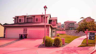A home is covered in fire retardant dropped to combat the Old Trails wildfire, in Spokane, Washington. AFP