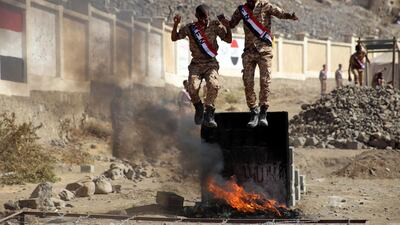 Yemeni fighters from the Popular Resistance Committees, supporting forces loyal to Yemen's Saudi-backed government, take part in a graduation ceremony in the country's third city Taez. AFP