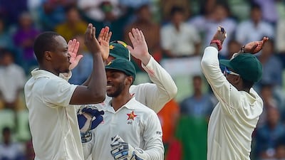 Tendai Chatara, left, helped put Zimbabwe in control against Bangladesh with three wickets. AFP