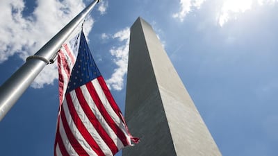 An American flag flies at half staff in honor of the victims of a mass shooting in Texas. Saul Loeb / AFP
