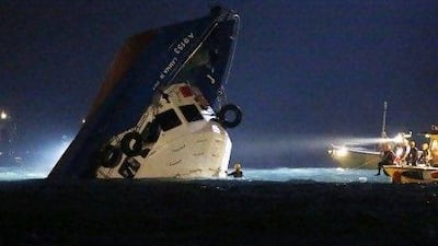 Rescuers patrol near a half-submerged boat after it collided with a ferry near Lamma Island off the south-western coast of Hong Kong Island.